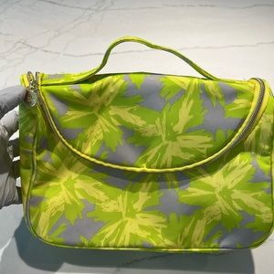 New Estée Lauder Makeup Bag with travel size samples and bottle.